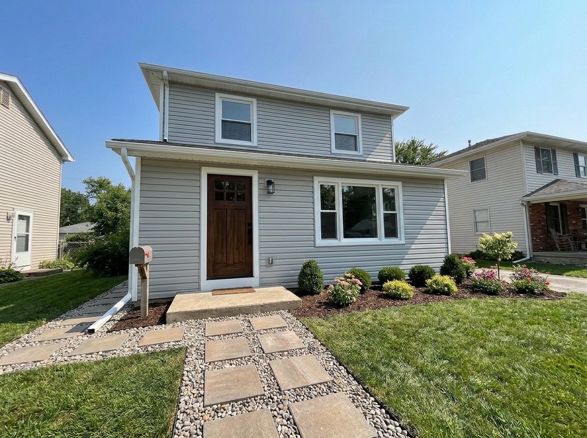 Refreshed home exterior with new siding and finishes